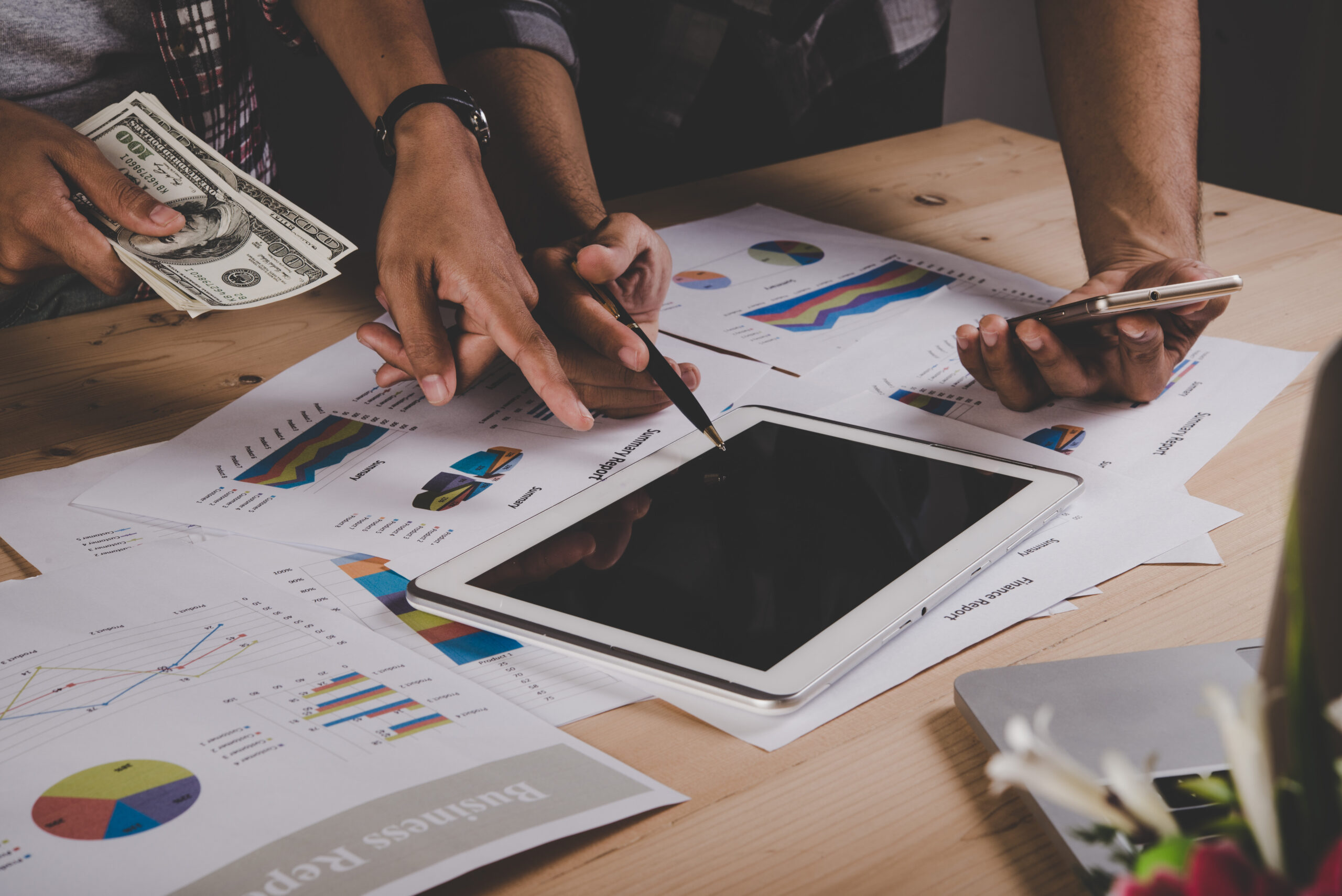 Finance team managing manual petty cash claims with paper forms and receipts for F&B hospitality operations